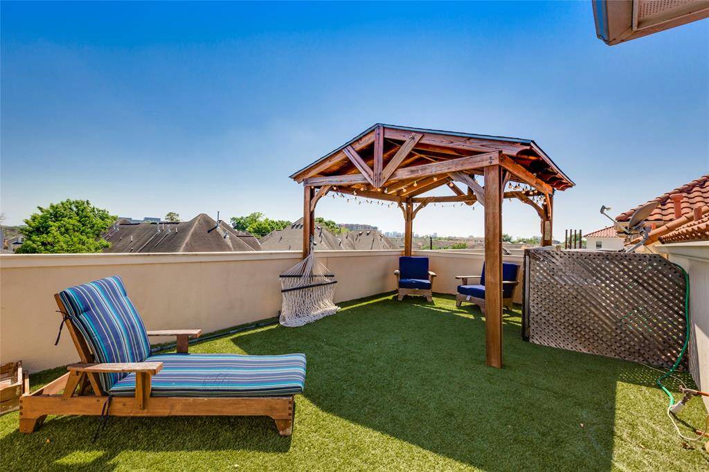Fourth Floor patio with easy to maintain astro turf - great views of Houston