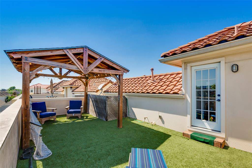 Fourth Floor patio with easy to maintain astro turf - great views of Houston