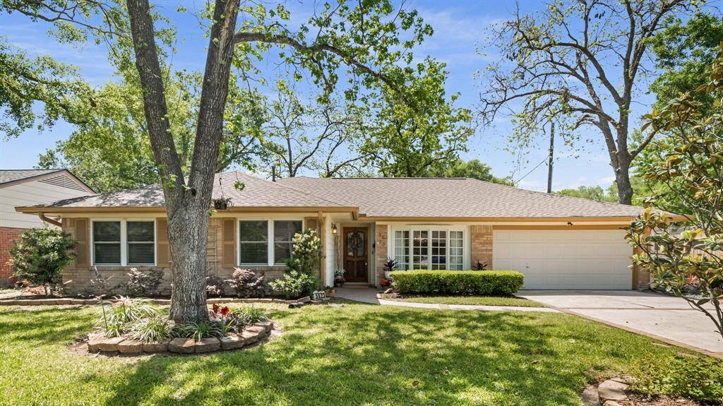 Welcome to 5623 Burlinghall Drive! This beautiful single story home has lovely curb appeal and is surrounded by trees.