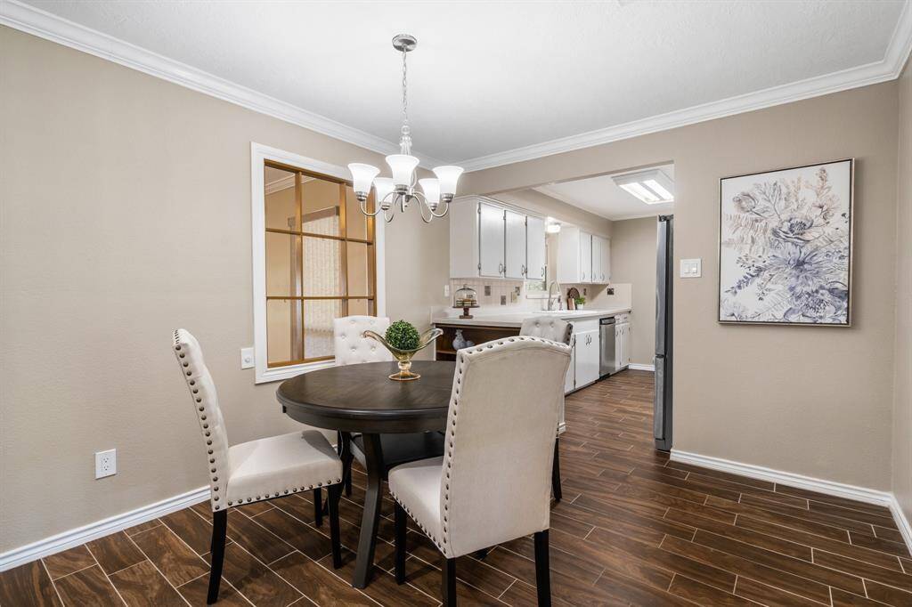 Breakfast room flows into the family room.  The window looks into the game room. More crown molding in this room.  These are all the details you won't find in todays new construction homes.