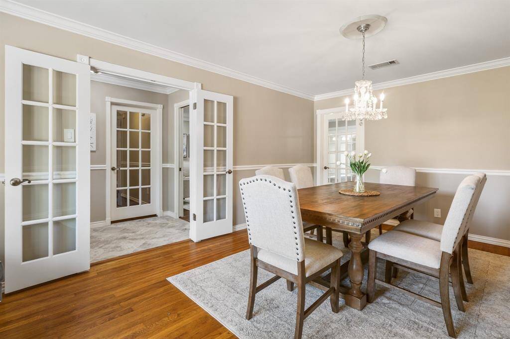 The french doors open into the entryway.