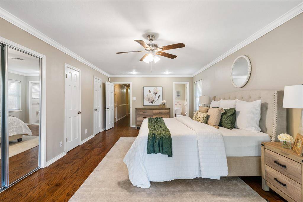 Primary suite also has crown molding and beautiful hardwood flooring.