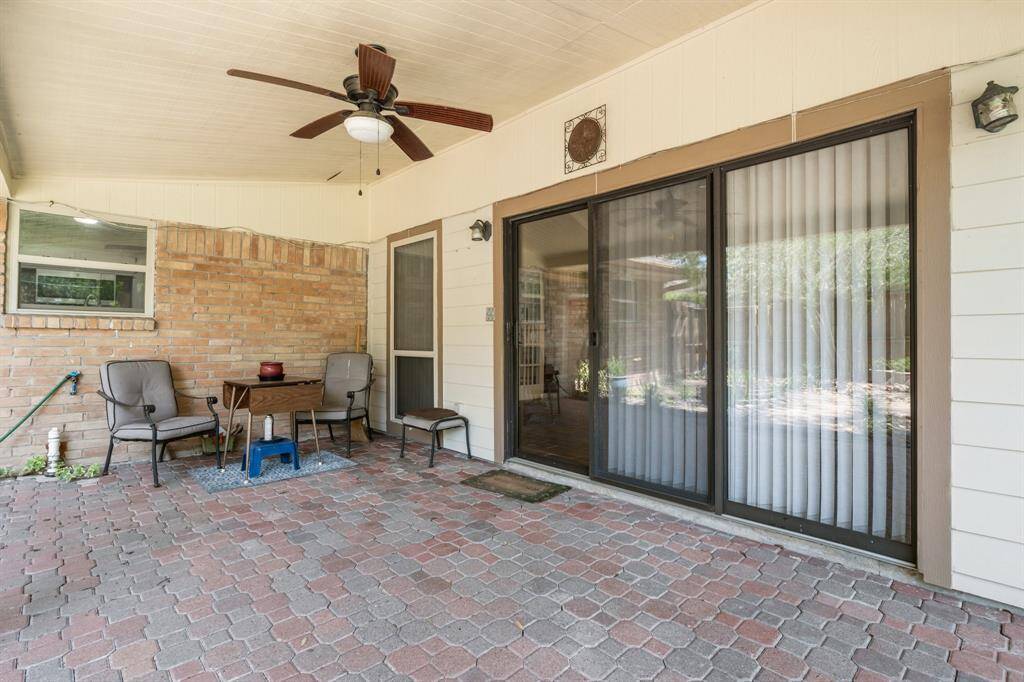 Ceiling fan will keep you comfortable when enjoying the backyard. Sliding glass doors open into the game room.