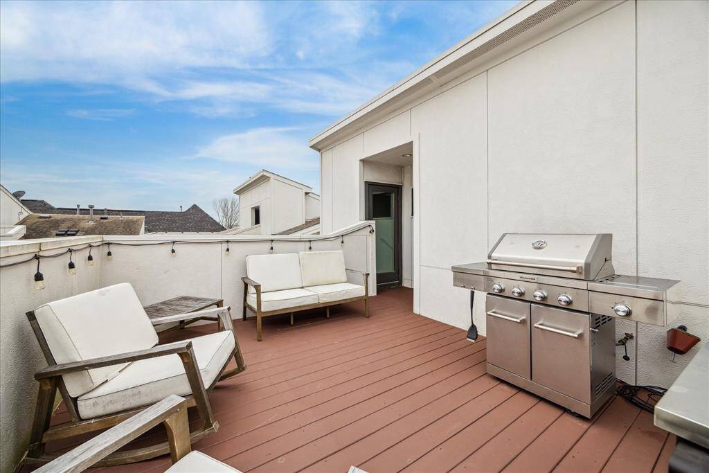 This wonderful roof retreat comes complete with wood decking, a water spigot, a natural gas connection and access to attic storage.