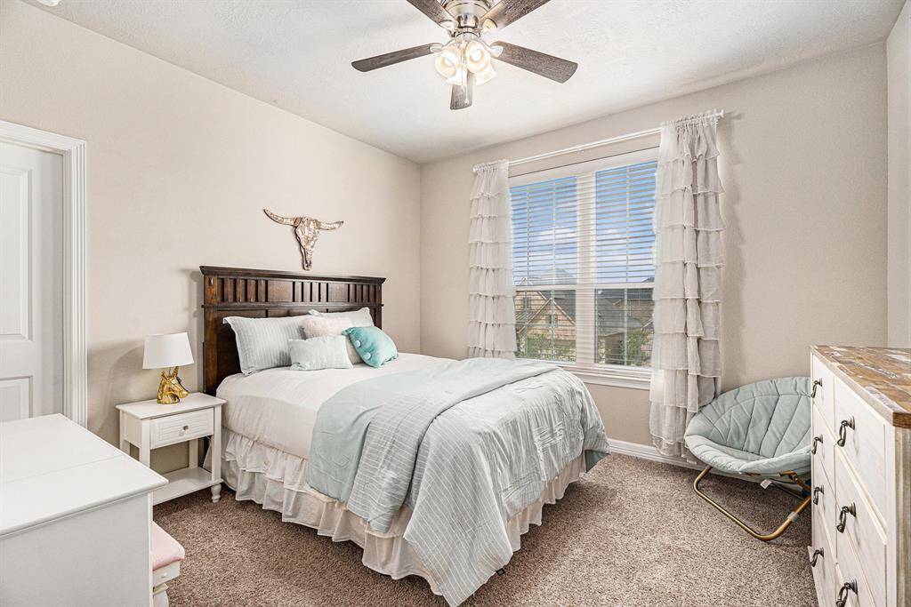 Secondary Bedroom upstairs featuring very large wall in closet