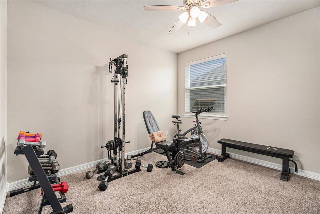Secondary bedroom currently being used for workout area