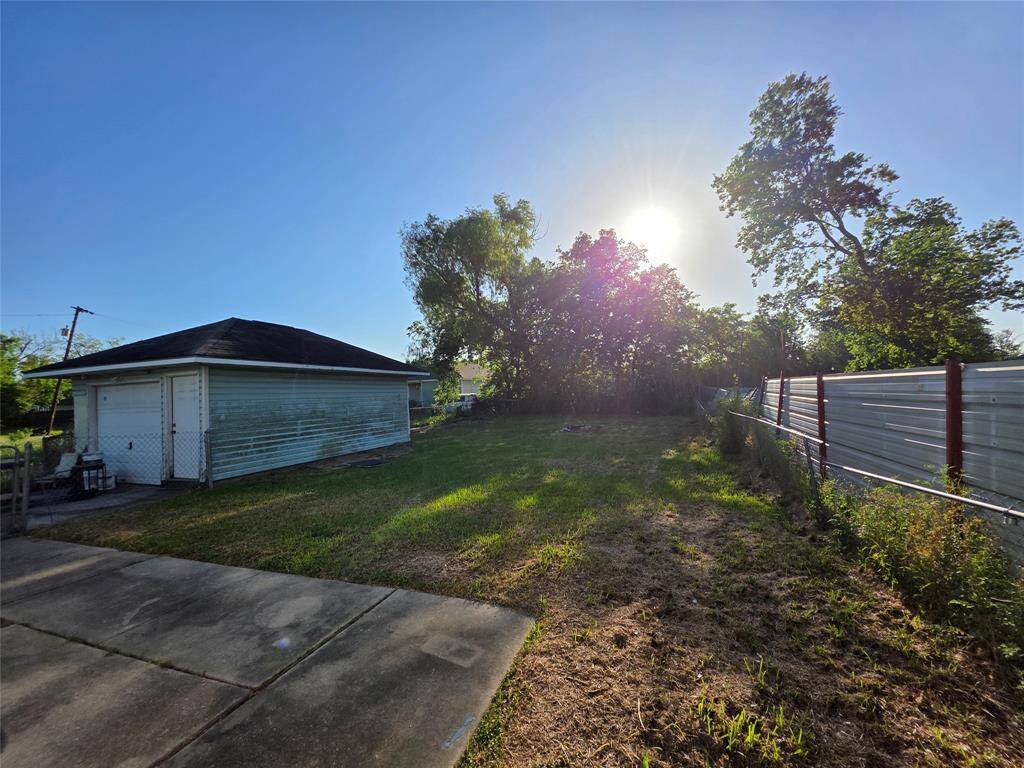 Backyard and view of the detached garage