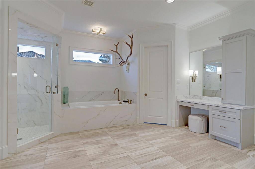 The primary suite features two generous walk-in closets, offering plenty of space and organization for effortless everyday living.