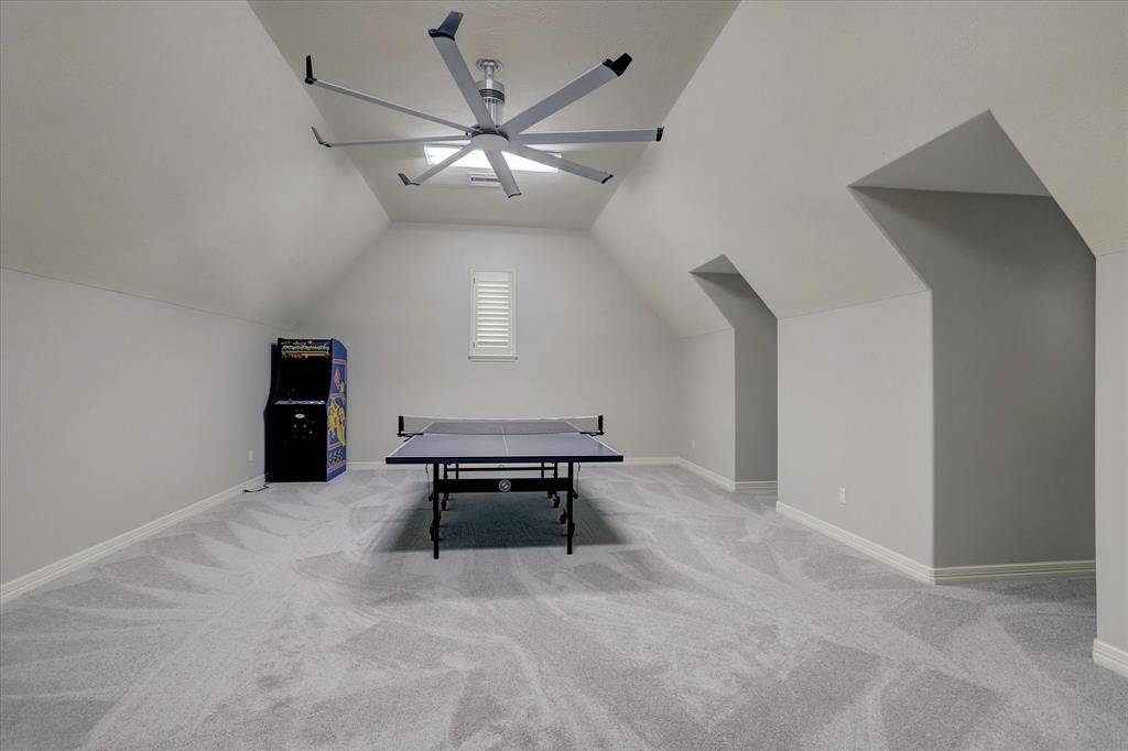 The second upstairs game room is perfect for pool, ping pong or could easily be used as a dance or exercise room.