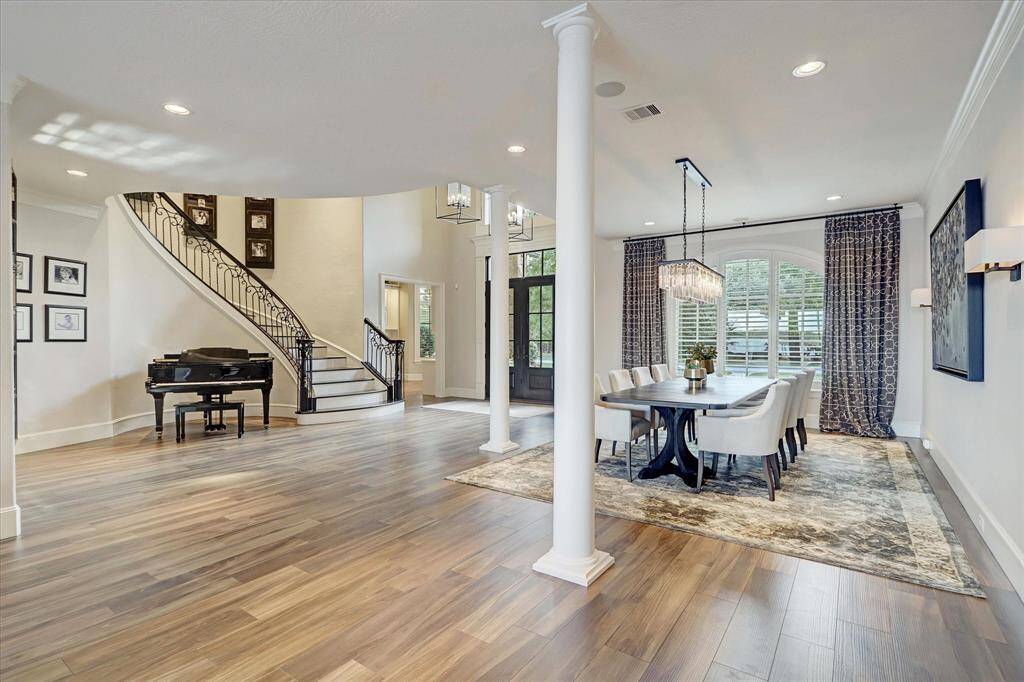 Gracious entry, sweeping staircase, formal living and dining perfectly set for refined living.