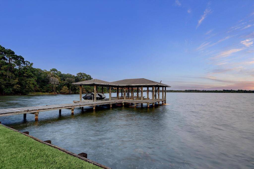 Boat dock with space for 3 boats and 2 jet skis, offering easy access to the water for all your outdoor adventures.