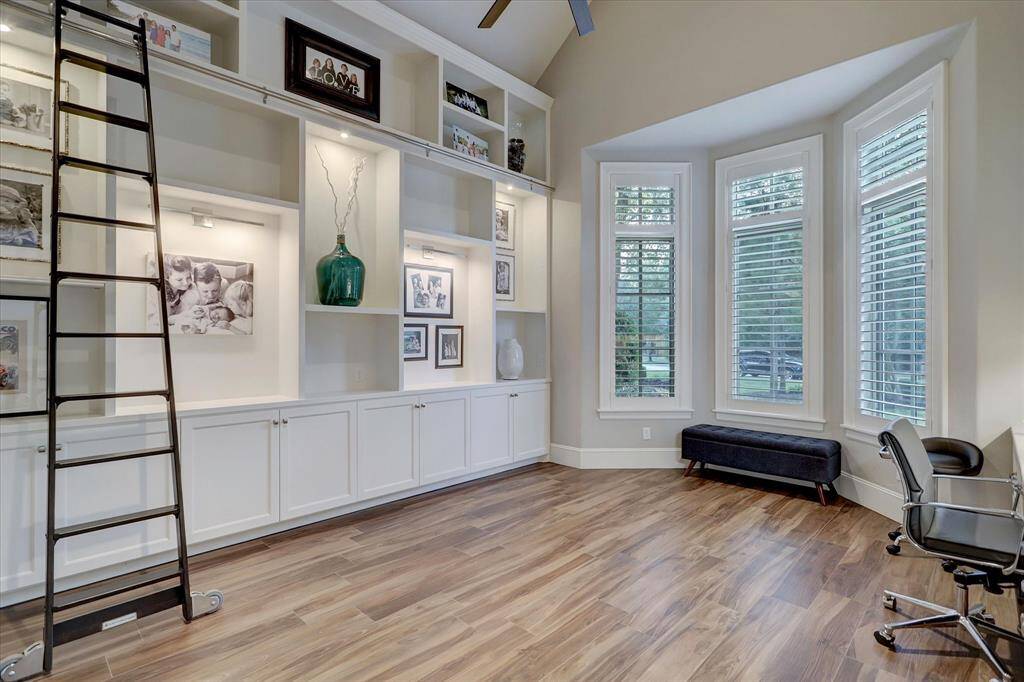 Private office with custom built-ins and ample storage for a seamless work-from-home experience.