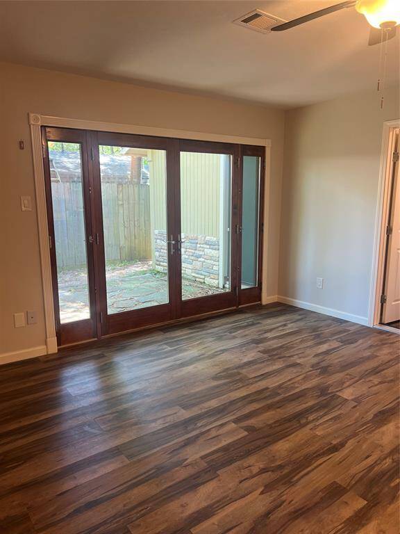 The living room has a nice big doors that can let in plenty of light and fresh air.