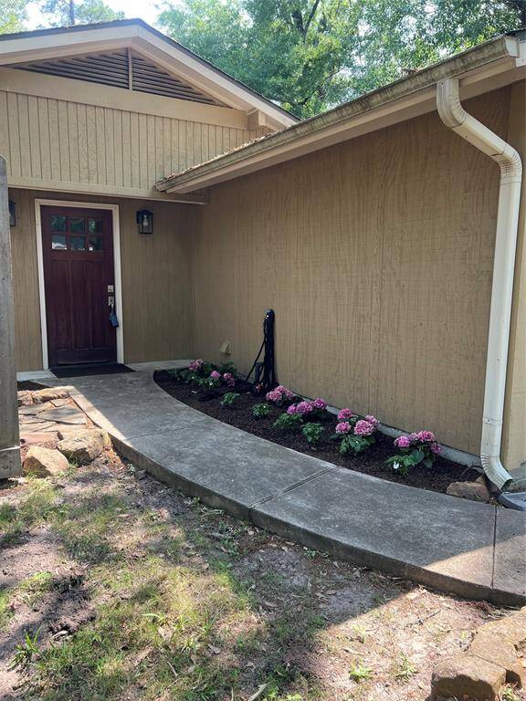 Fresh landscaping in the private front yard pathways.