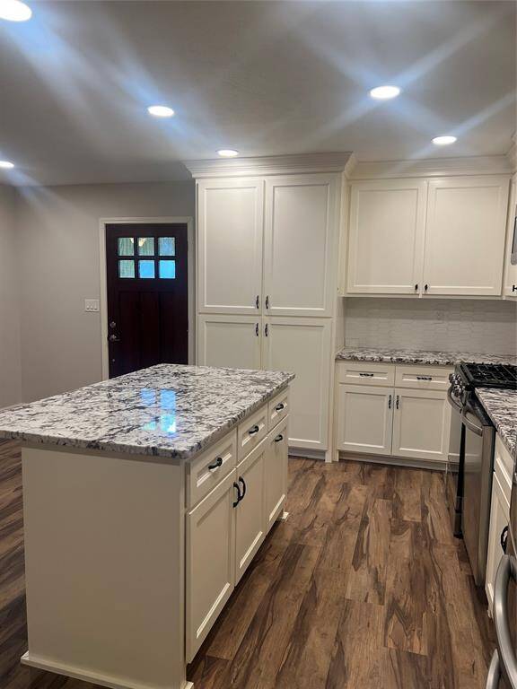 View of the kitchen looking towards the fron door.