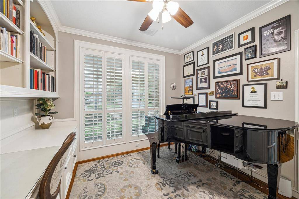 Beautiful private study also doubles as a well-loved music room with French doors and plantation shutters.