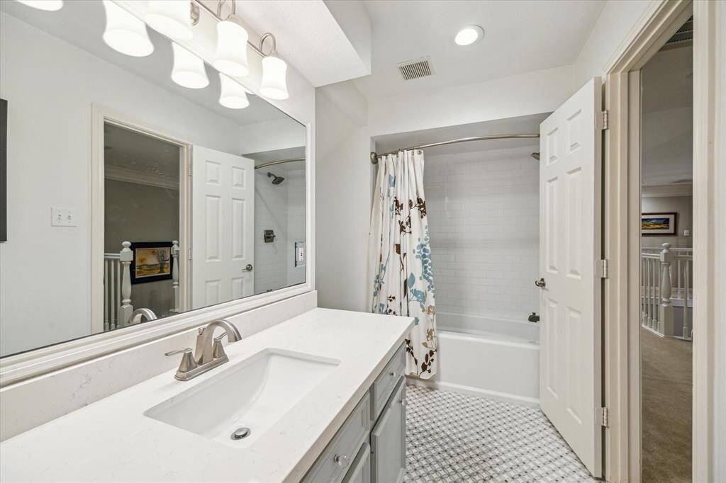 Bathrooms are all designed with beautiful countertops and elegant tile floors.