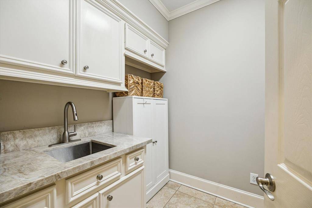 Enjoy a fresh start with this well–organized laundry room.