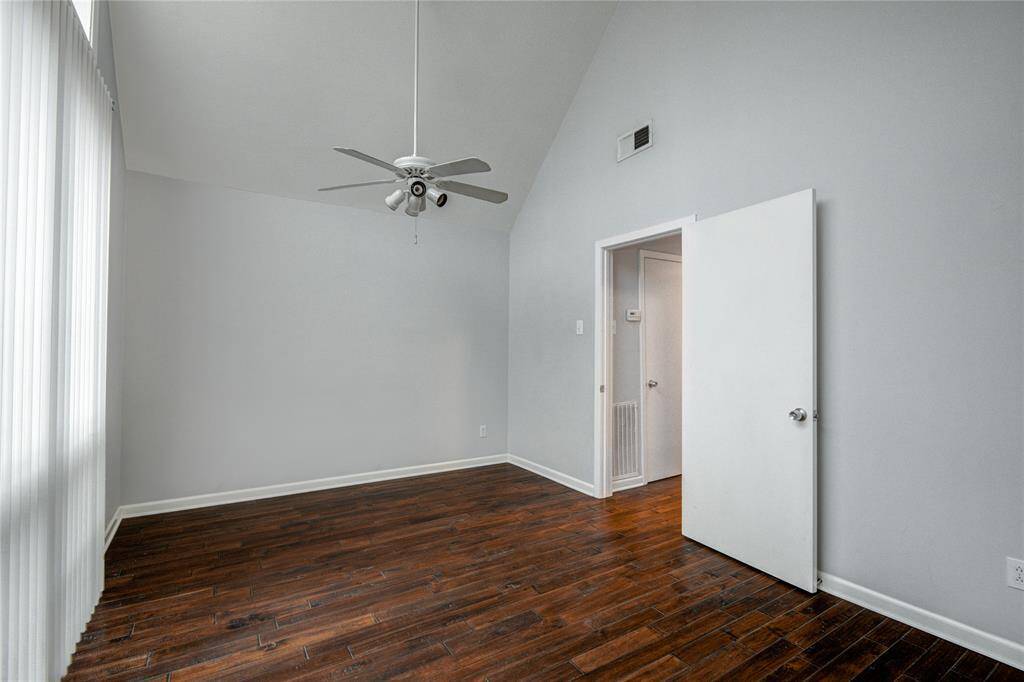 Bedroom has super high ceilings & solid Koa wood floors