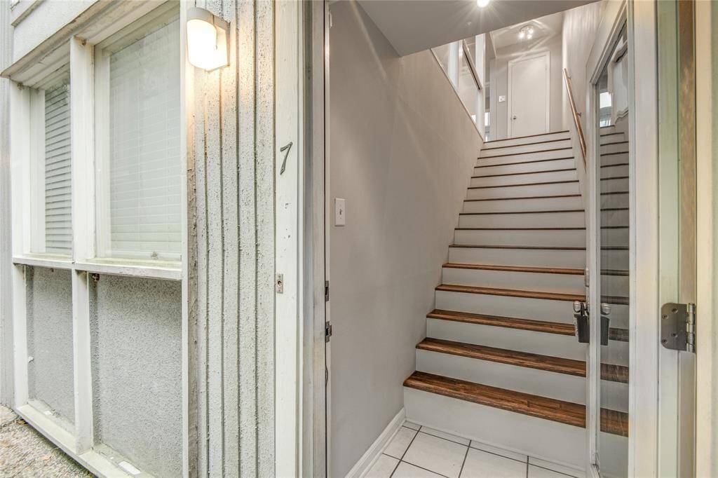 Private stairs of your unit take you inside & to your first closet