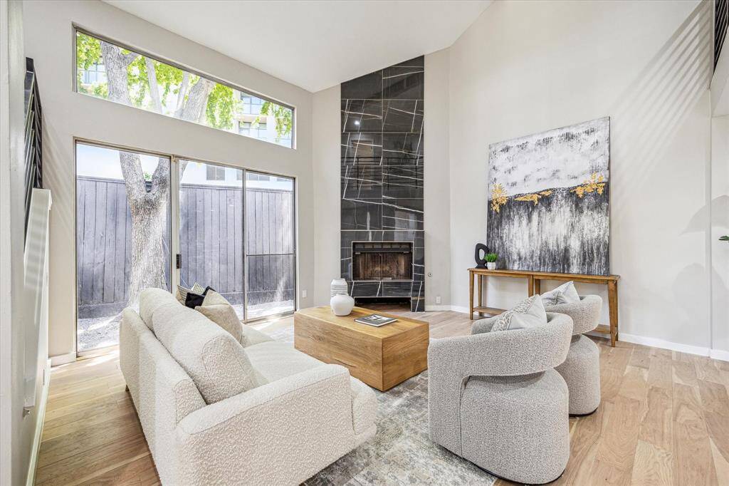 This home features multiple outdoor living spaces—including a private gated courtyard entry, a separate ground-floor fenced area, and a second-floor balcony off the owner’s retreat.