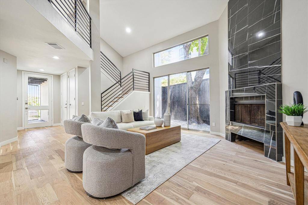This urban retreat is filled with impressive updates, far too many to list, but here’s a start: rich White Oak hardwood flooring, fresh paint and sheetrock, upgraded lighting, modern fixtures, a stunning floor-to-ceiling marble fireplace, sleek metal railings & balusters, and stylish hardware, all thoughtfully selected to elevate everyday living.