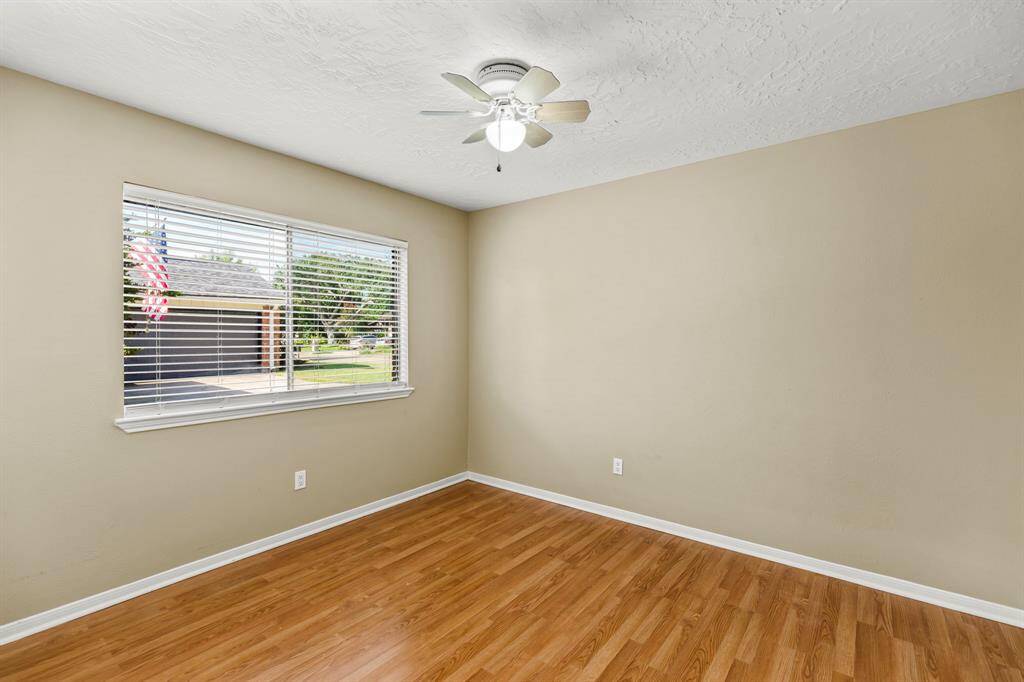 One of the spacious secondary bedrooms with the large window to let in plenty of natural light