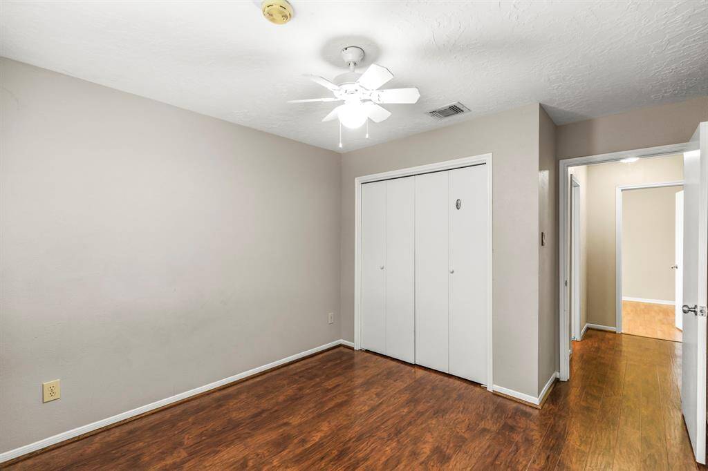 The other view of the a secondary bedroom with spacious closet