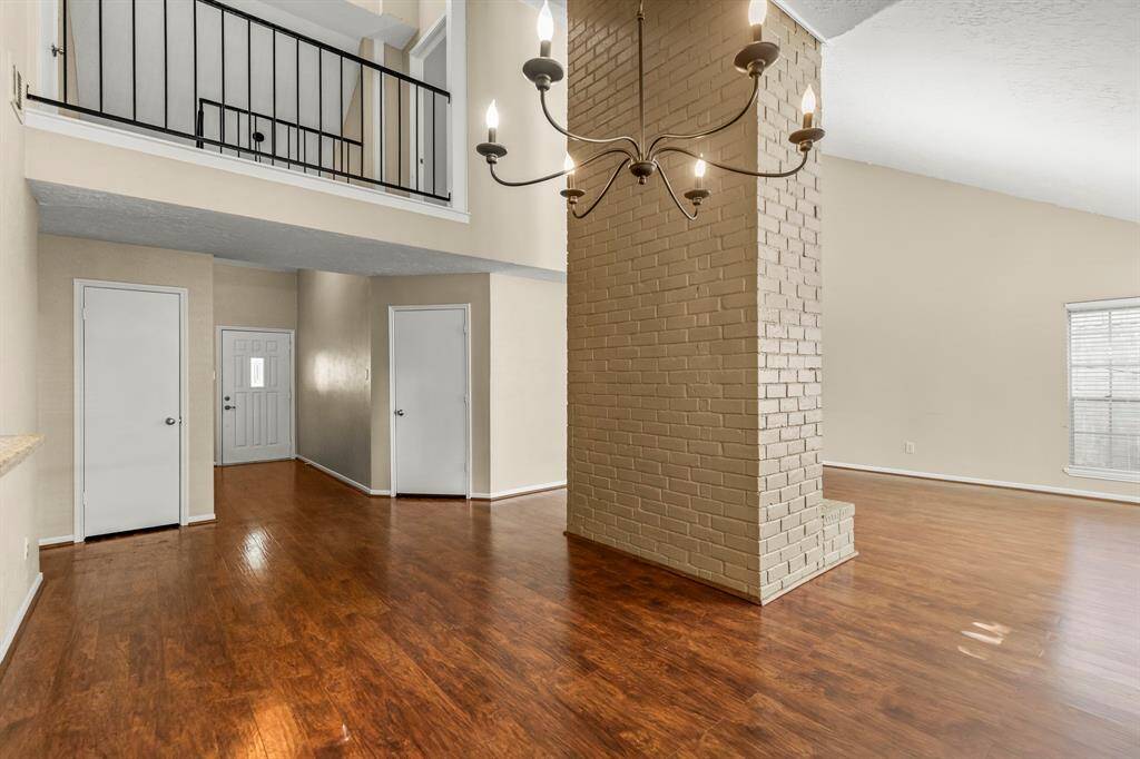 The dining area has plenty of room for a large dining table and other furniture, and opens to the living room.