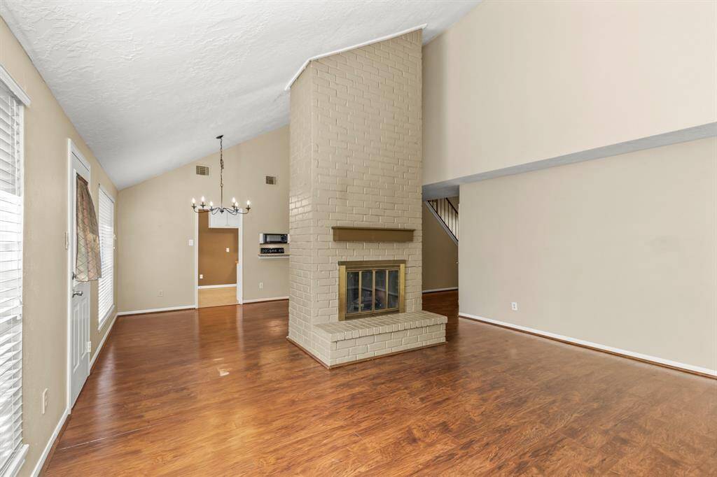The ceiling is vaulted for that open feeling, and the room is spacious and has room for everything!