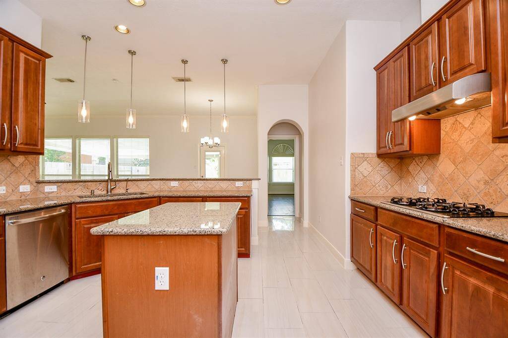 Pendant and recessed lighting brightly illuminate your chefs kitchen