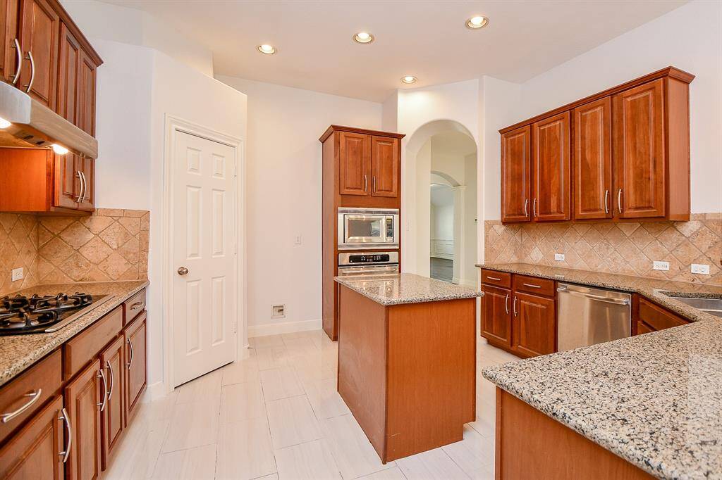 There no shortage of storage with this array of cabinets and pantry