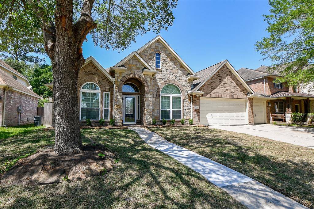 Mature trees in the front provide great shade while you relax in the yard.