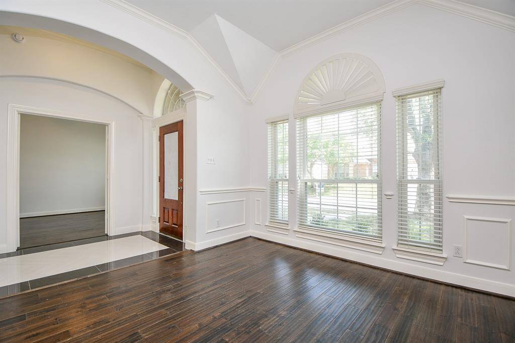 The Great Room features crown molding and wainscoting details along the walls