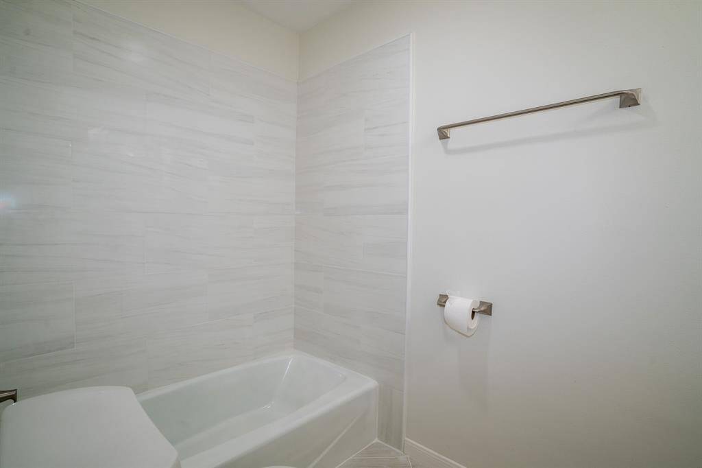 Second full bathroom with tub-shower on second floor