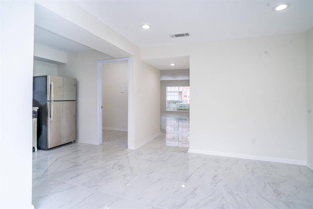 Family room and/or dining room showing entrance to kitchen
