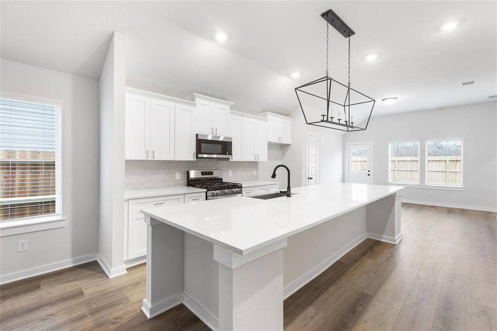 Light and airy kitchen. Ample cabinets!