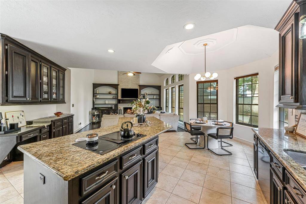 The open-concept layout seamlessly connects the spacious kitchen, breakfast area, and living room—ideal for entertaining.