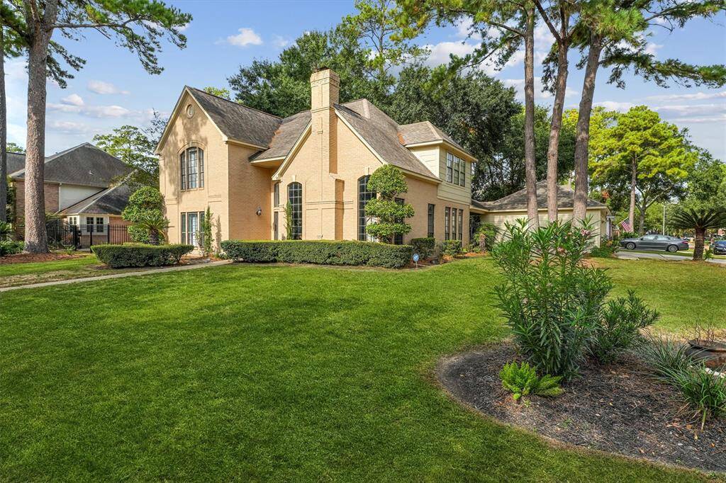 This stunning home sits on an oversized corner lot, offering expansive green space, mature trees, and impressive curb appeal from every angle.
