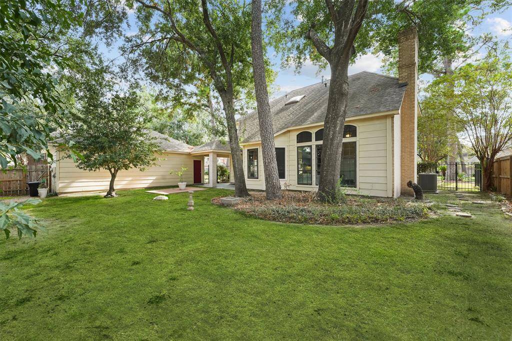 Situated on a spacious corner lot, this home offers a serene backyard retreat with mature trees, lush green space, and plenty of room to relax or entertain.