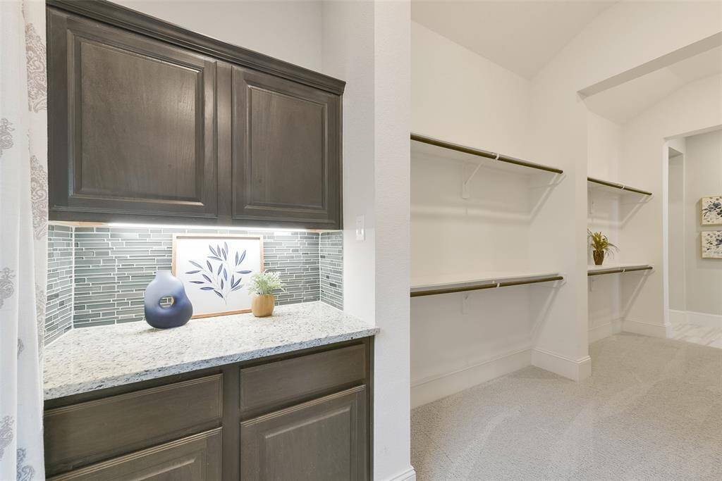 Large passthrough closet in the primary suite, with dressing area on the other side. (Not shown in the Photos)