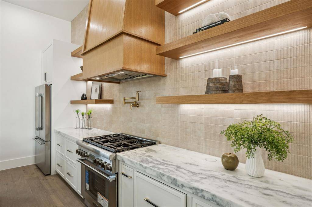 The home includes a stainless steel thermador appliance package.
