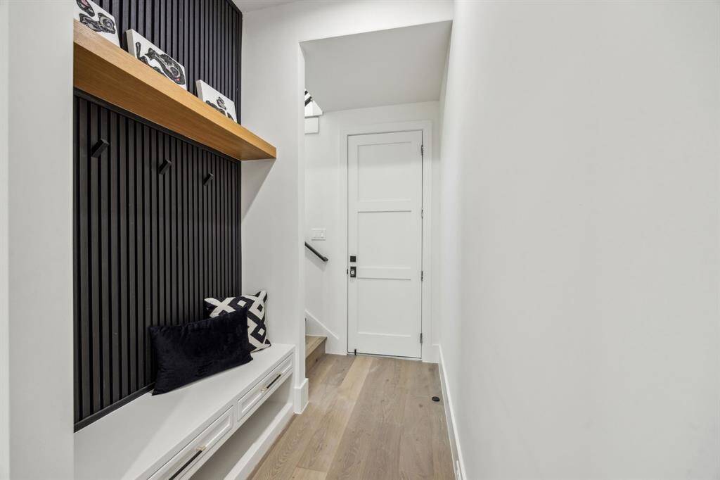 The mud room. The stairs lead to the flex space. The door is to the garage.