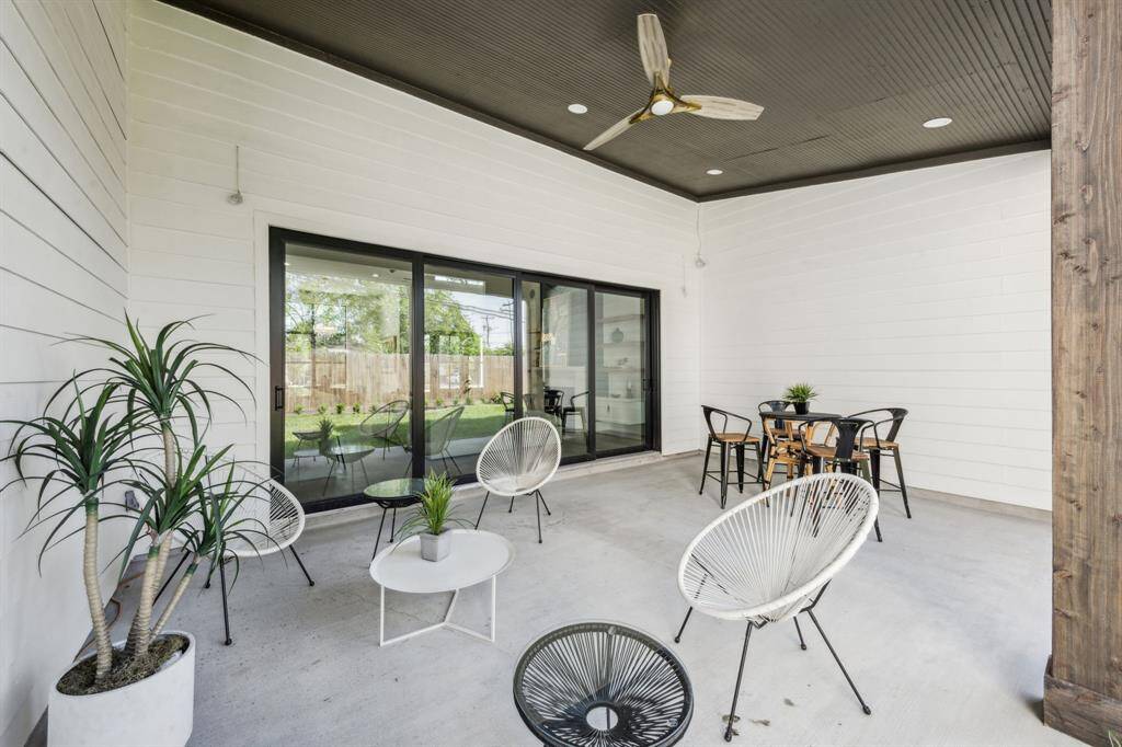 Exit the four paneled sliding stacker doors to your spacious covered patio with room for living and dining.