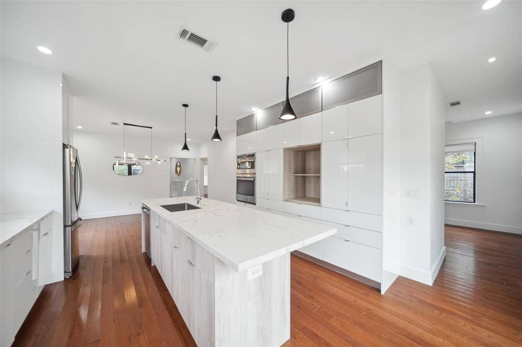 Stainless steel appliances and an abundance of cabinetry make this kitchen a hotspot for entertaining and the heart of the home.