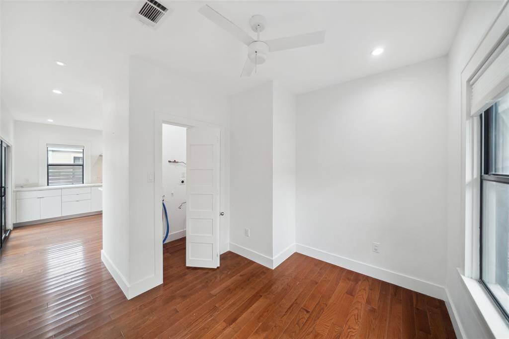 Looking back towards the kitchen, this angle shows the laundry room - big enough to hold a full sized washer and dryer.