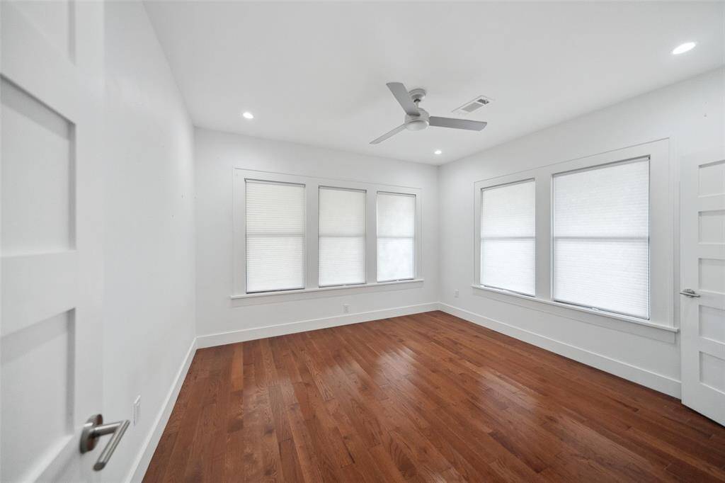 The front bedroom has also has hardwood flooring and amazing views of the porch and front yard.