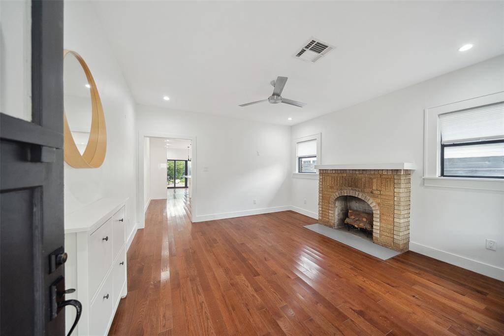 As you enter notice the beautiful hardwoods that continue throughout the home.