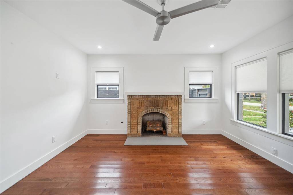 The focal point of the front living room is the original fireplace. A mix of old world charm with modern conveniences.