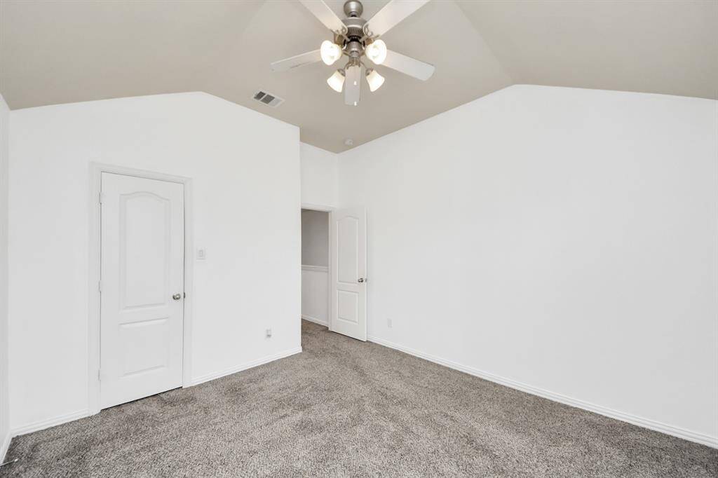 The second of five bedrooms, featuring ample space and natural light.